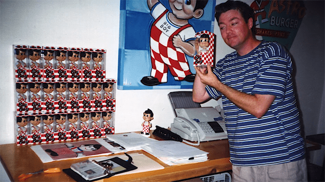 OG Funko founder Mike Becker posing with the company's first product in the 1990s